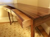 Crescent front writing desk